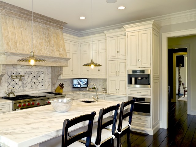 antique white kitchen cabinets with dark island