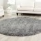 Enhance Plain Spaces with small round rugs